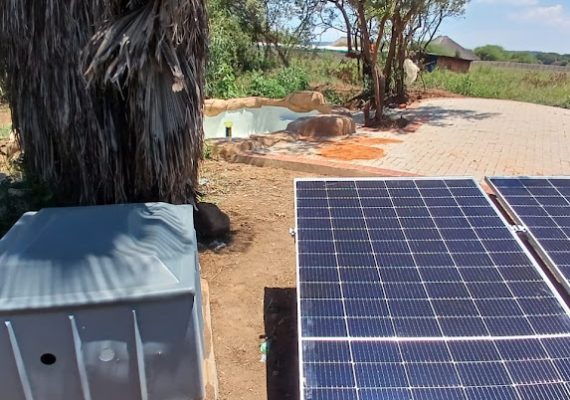 Solar Panels next to a solar pool pump